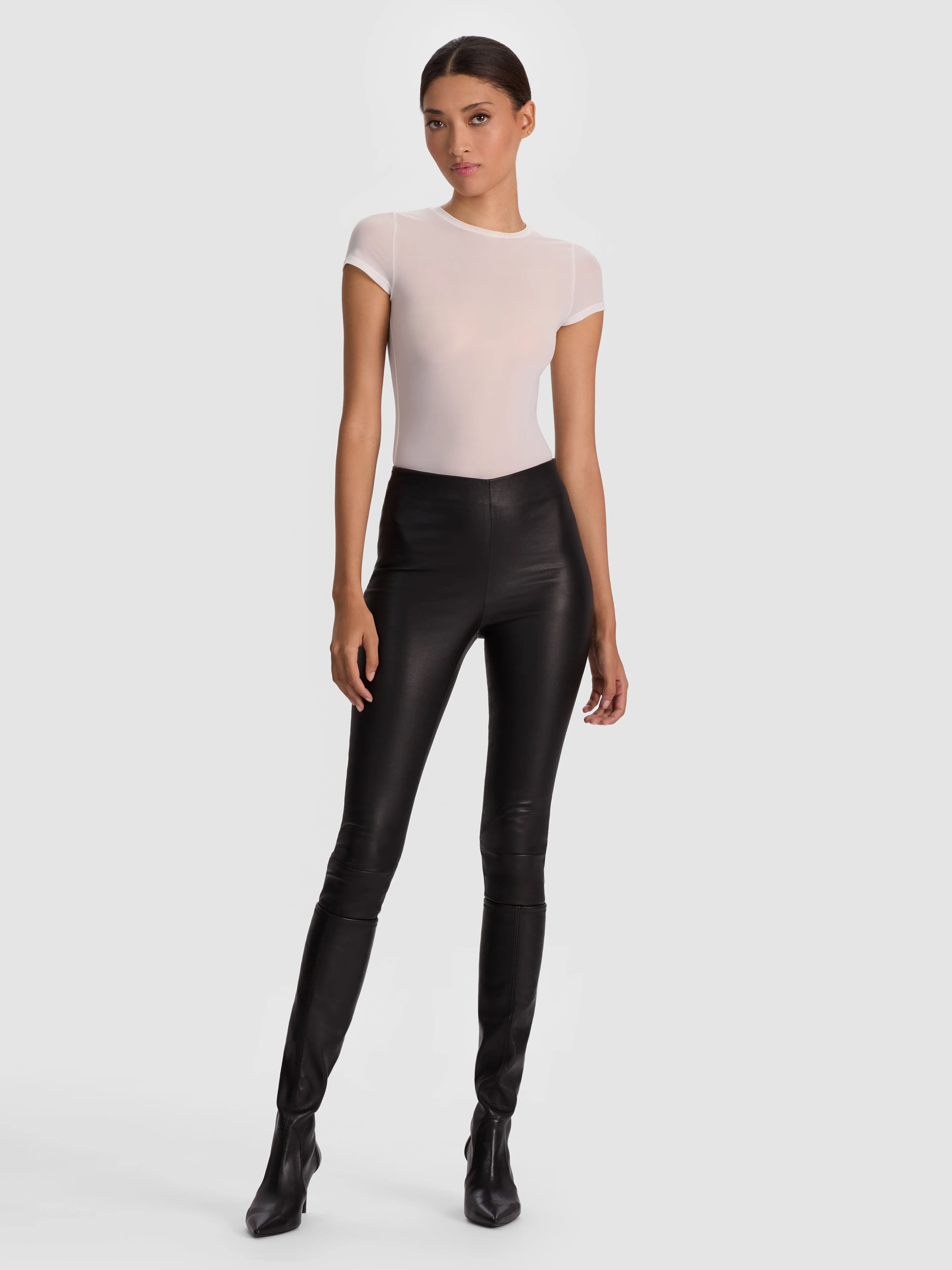 ALICE + OLIVIA Lennox Leather Legging in black lamb leather worn as part of Jess Hart's NYFW look