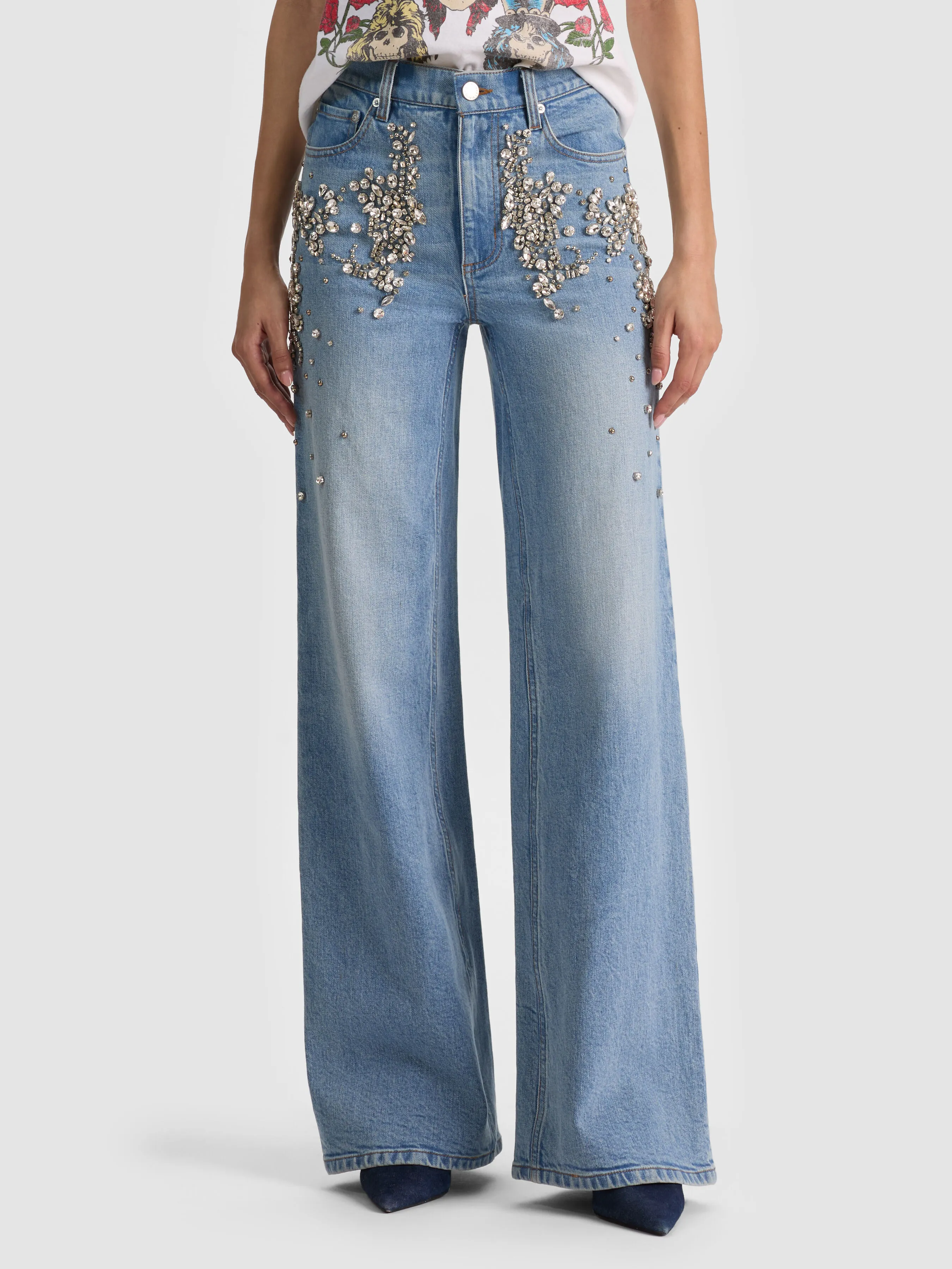 A close-up editorial shot of the ALICE + OLIVIA Chic Embellished Jean featuring light-catching rhinestones, highlighting the elevated embellished denim trend for 2026.