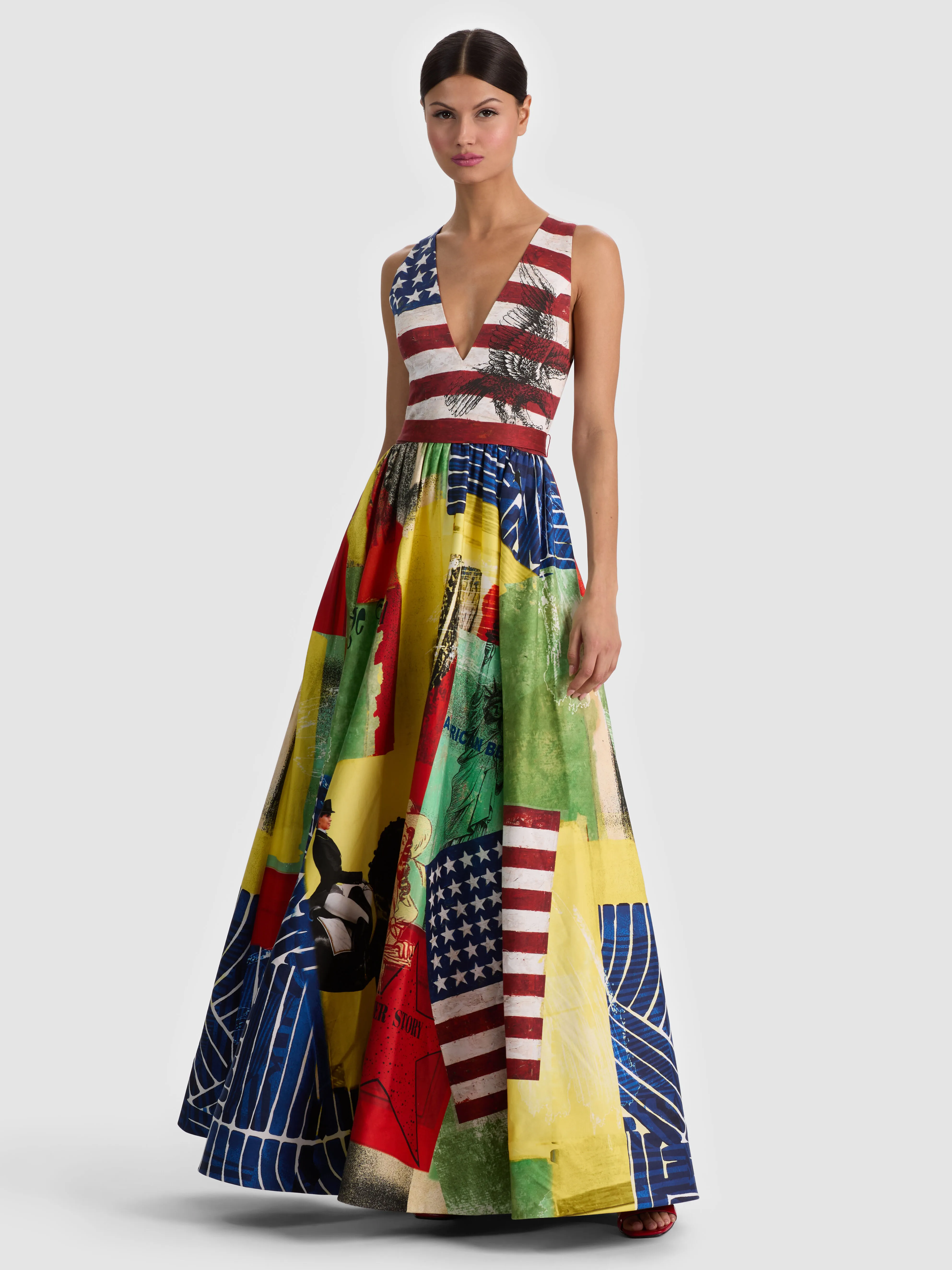 A model wearing a dramatic floor-length gown with a sleek silhouette, styled for a formal gala or black-tie wedding