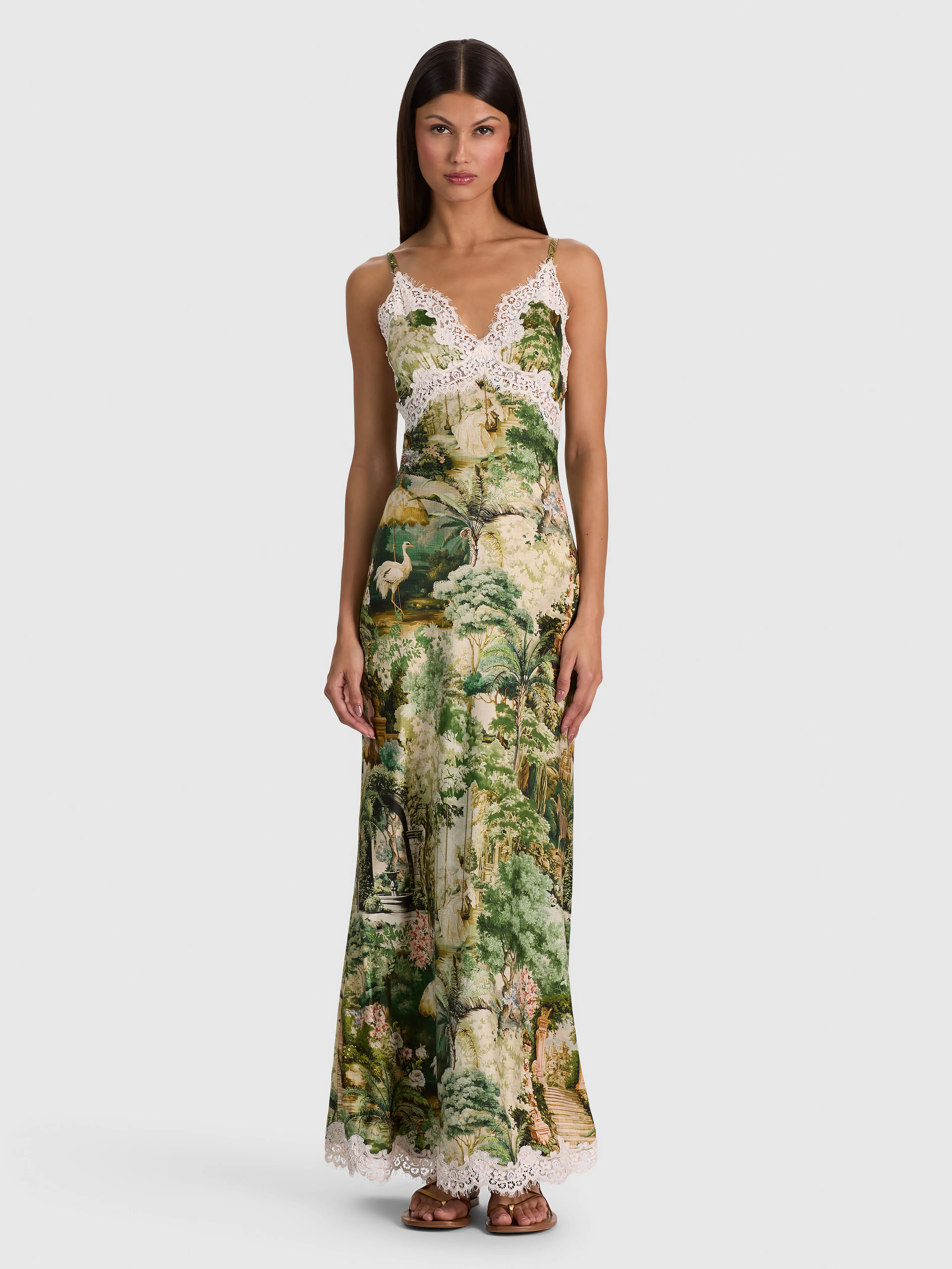 Multiple models wearing a variety of ALICE + OLIVIA midi dress styles, including the Julietta Lace Slip Dress, Gemma Midi Dress, Anya Midi Dress, and Nina Embellished Midi Dress.
