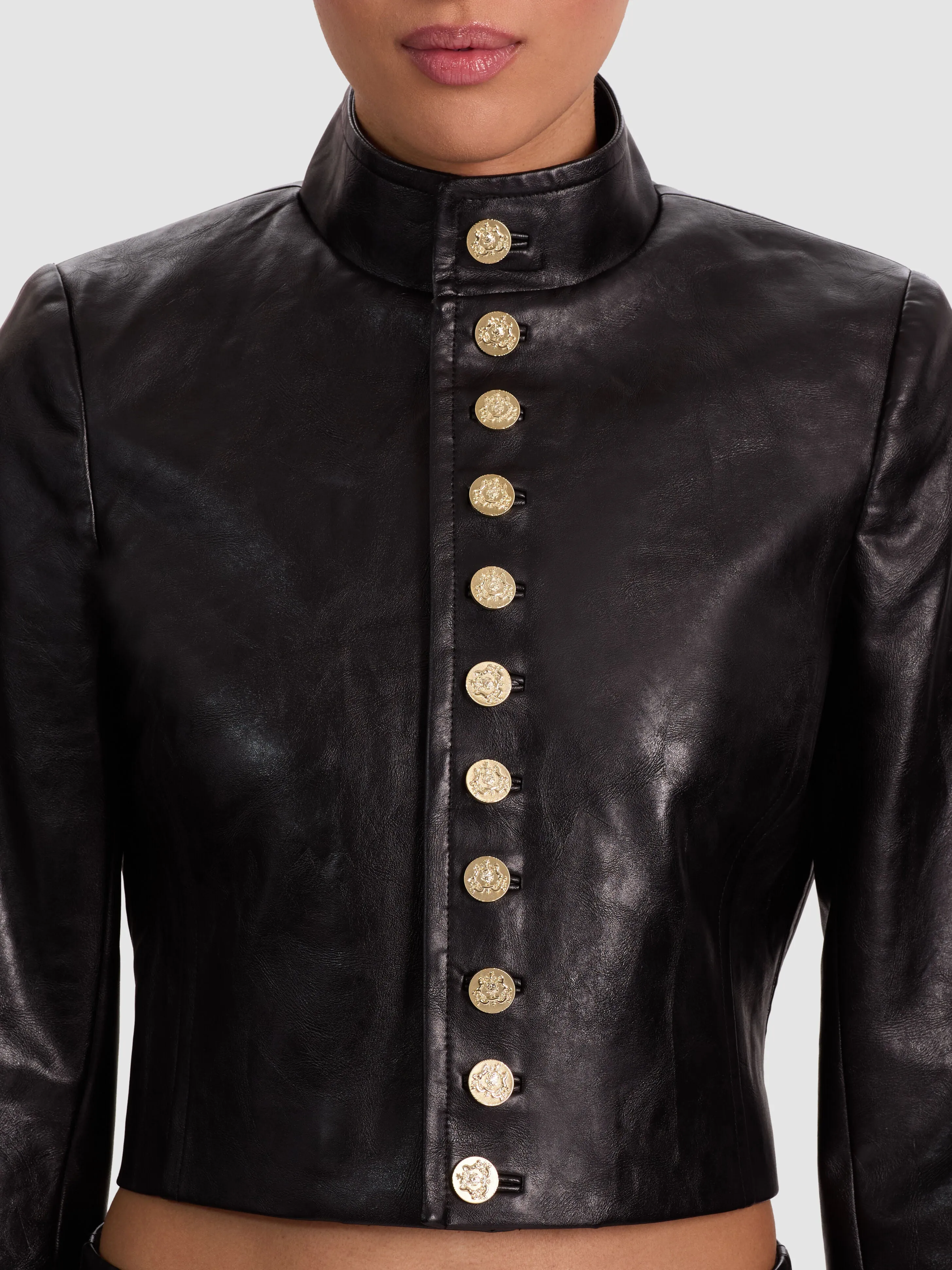 ALICE + OLIVIA Emerson Vegan Military Jacket in Black distressed vegan leather with gold button closures