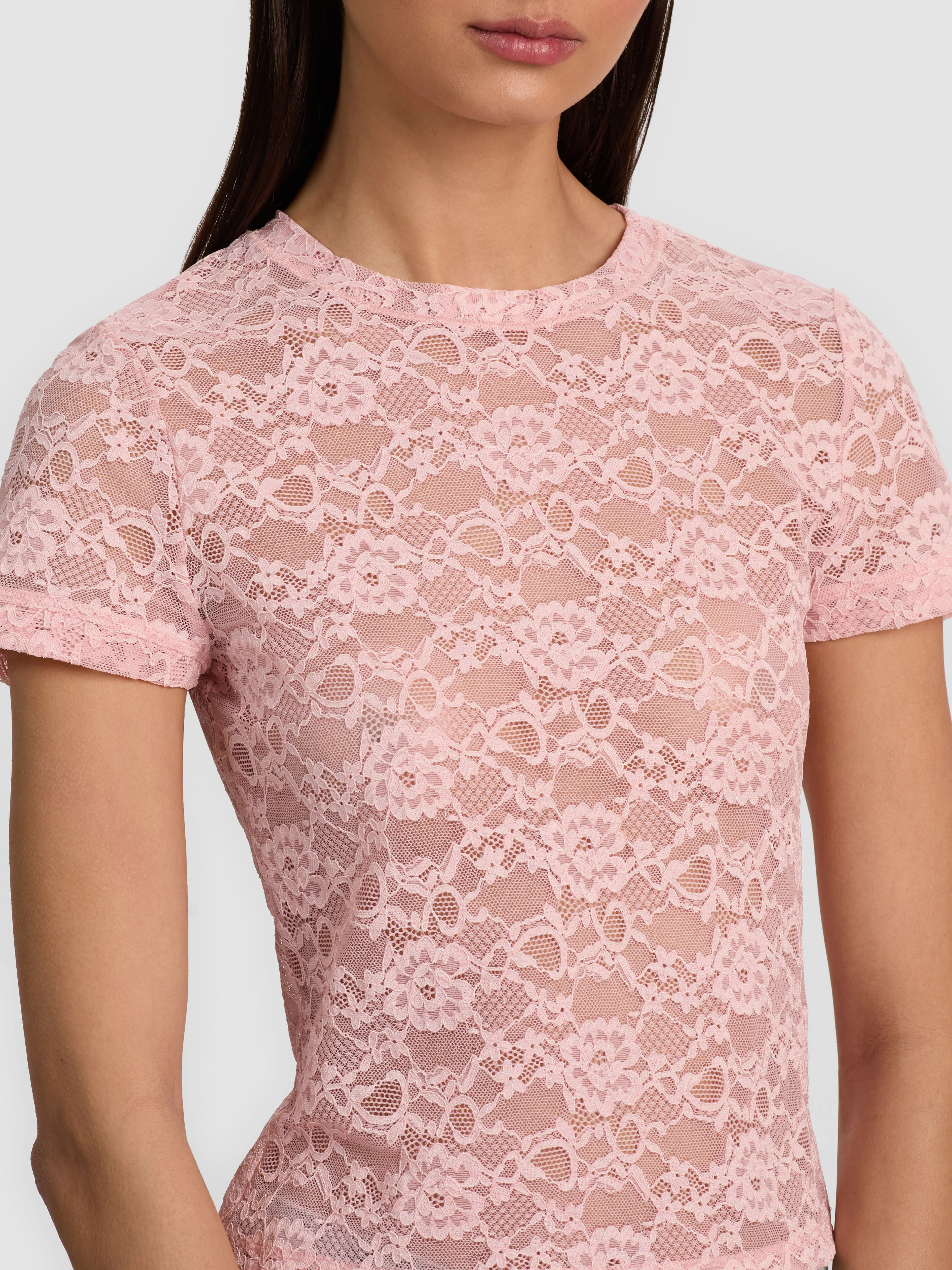 ALICE + OLIVIA Tess Tee in sheer lace, cropped crew-neck baby tee as worn by Nia Sioux at NYFW 2025