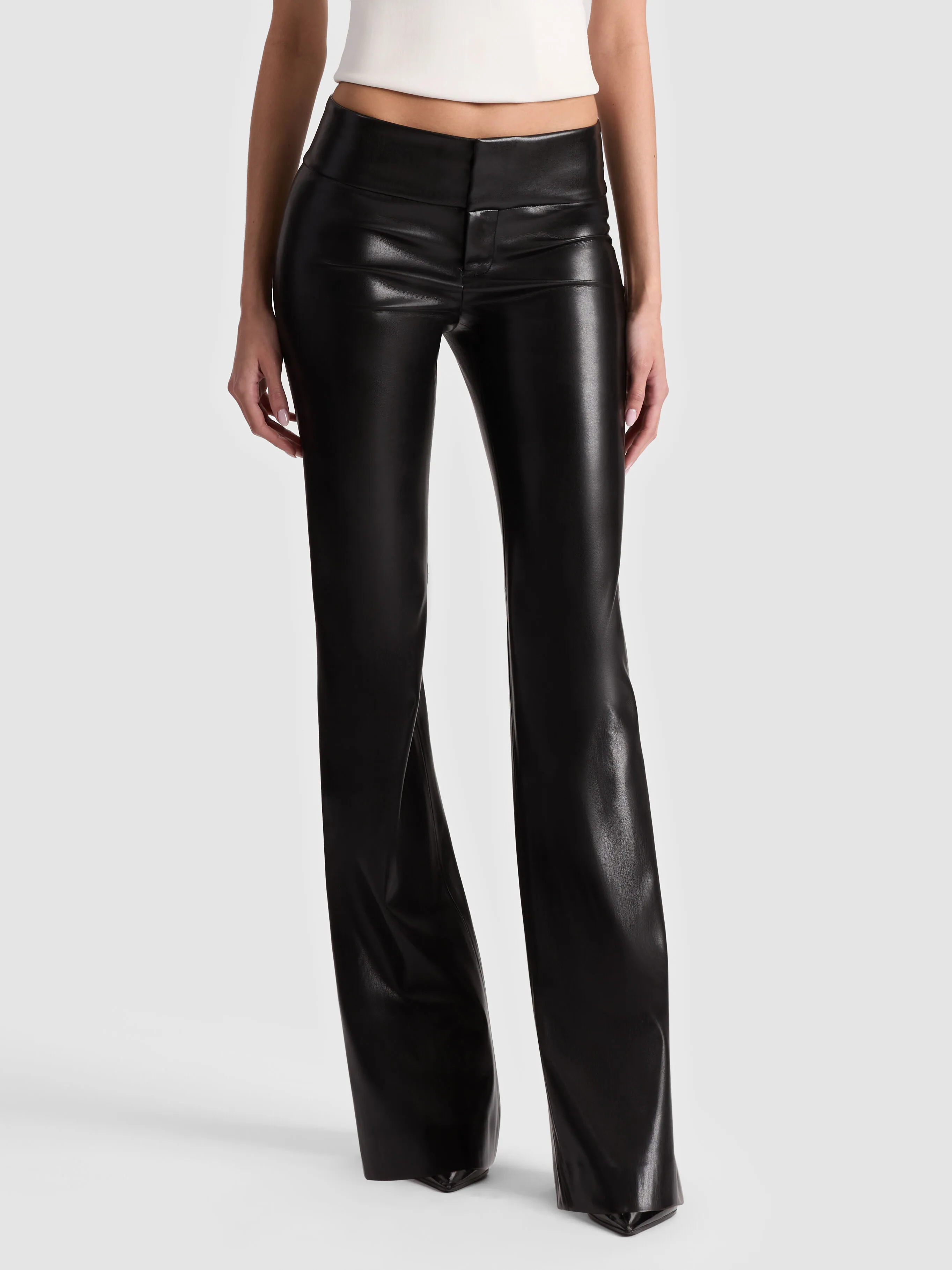 The ALICE + OLIVIA Olivia Vegan Bootcut Pant in black vegan leather — a sleek, full-length view showing the classic bootcut flare from a clean angle.