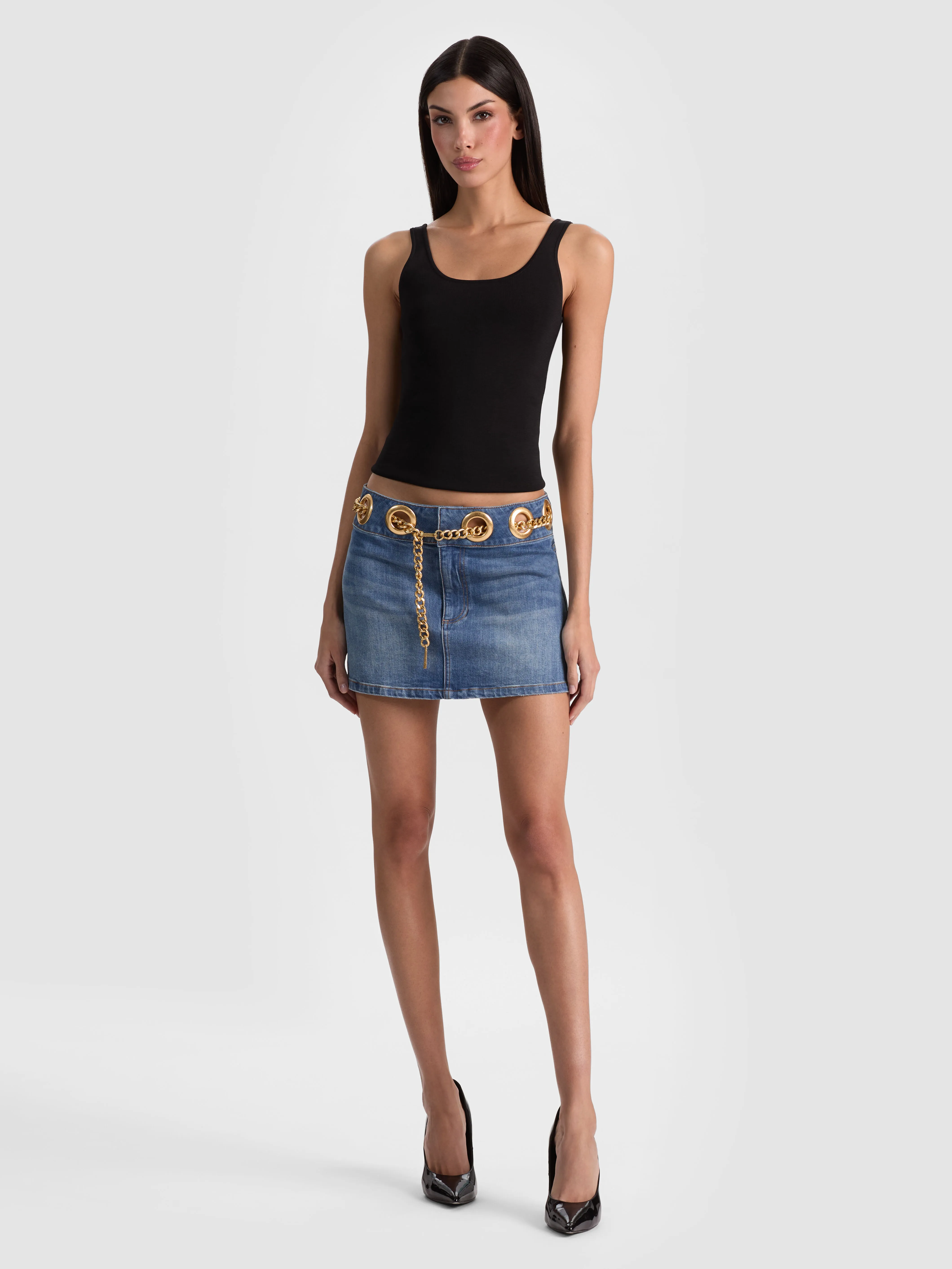 A sequined party skirt in a bold color paired with a sleek top for a night of celebration
