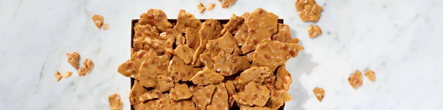 Golden peanut brittle with roasted peanuts